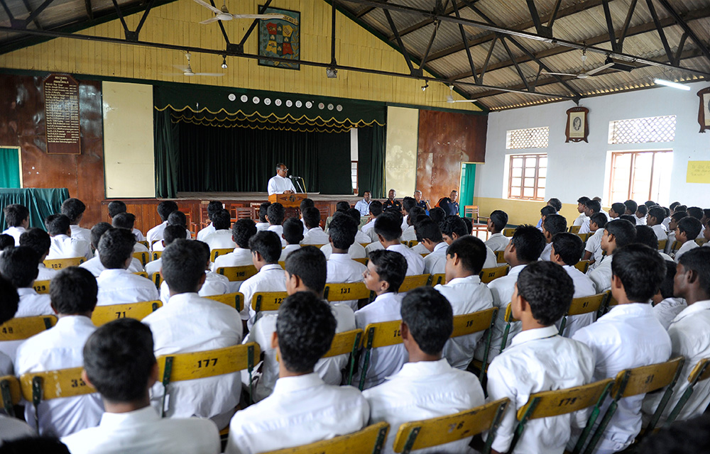 St. Patrick’s College Rector Rev. Father Jerome Selvanayagam addressing the students during NCHS visit to St. Patrick’s College to donate cricket gear.